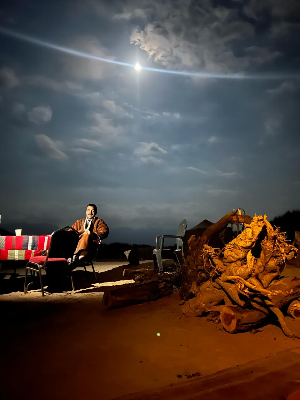 Mohammad Fdoul, owner and guide at Desert Wolf Horse Riding, relaxing at the campfire.